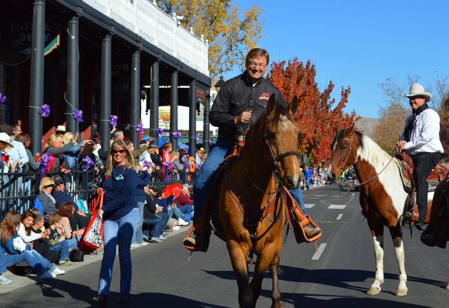 U.S. Sen. Dean Heller, R-Nev., rides on a horse in the Nevada Day parade in Carson City on Oct. 26, 2013.